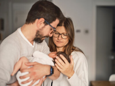 mother and father with baby