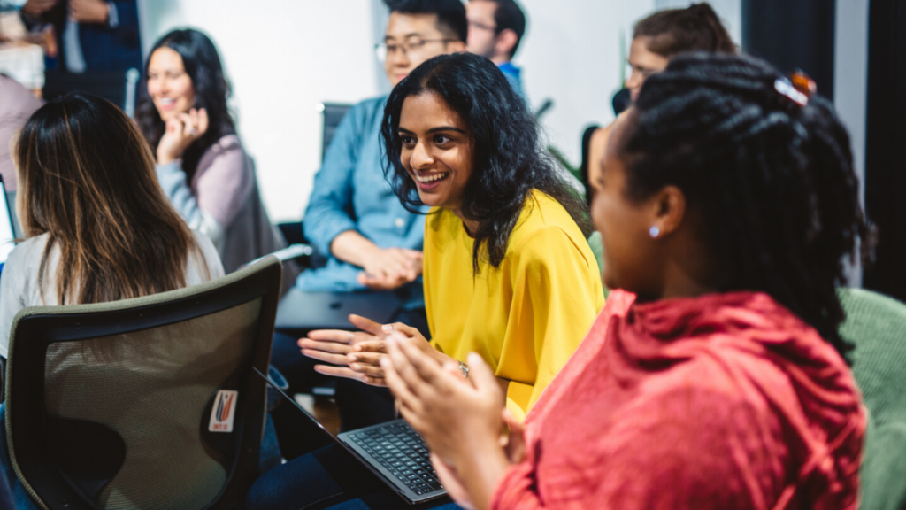 women smiling in meeting